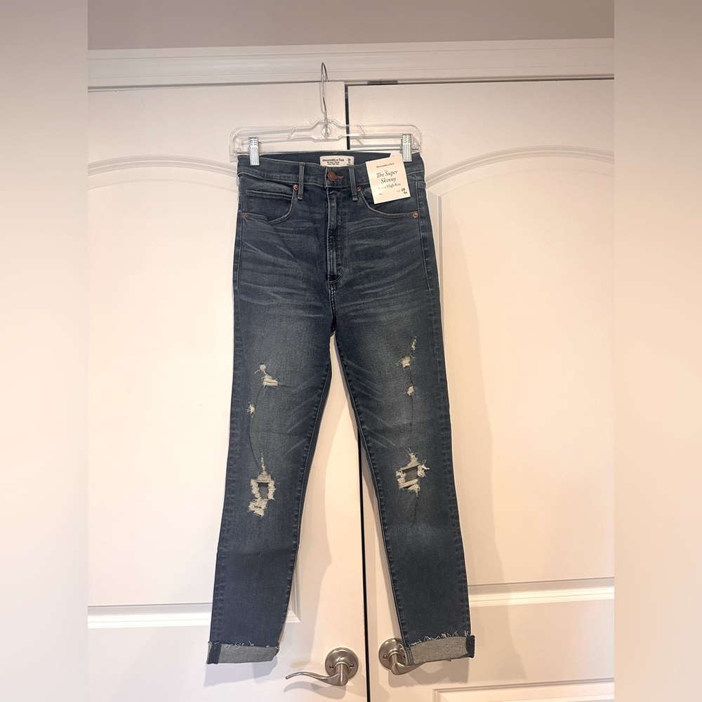 NWT - super skinny high rise distressed jeans - med/dark wash.